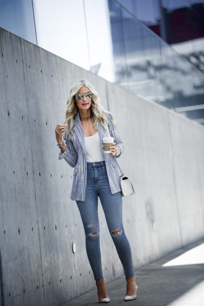 Heather Anderson wearing blazer, white pumps, and ripped jeans
