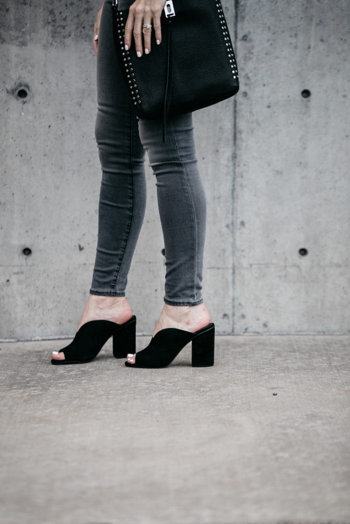 Gray skinny jeans and black suede mules 