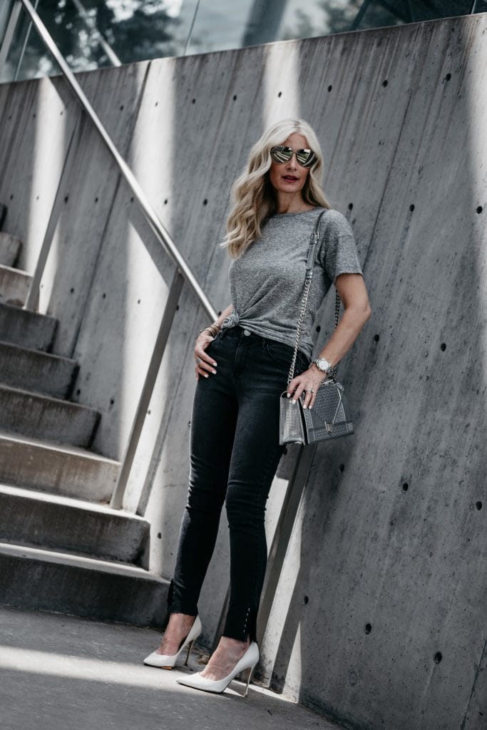 Gray tee, black jeans and white pumps