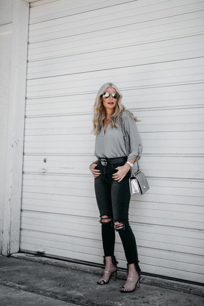 Dallas fashion blogger wearing L'agence black ripped jeans and heels 