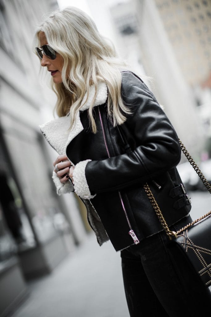 Dallas blogger wearing shearling moto jacket and leopard boots