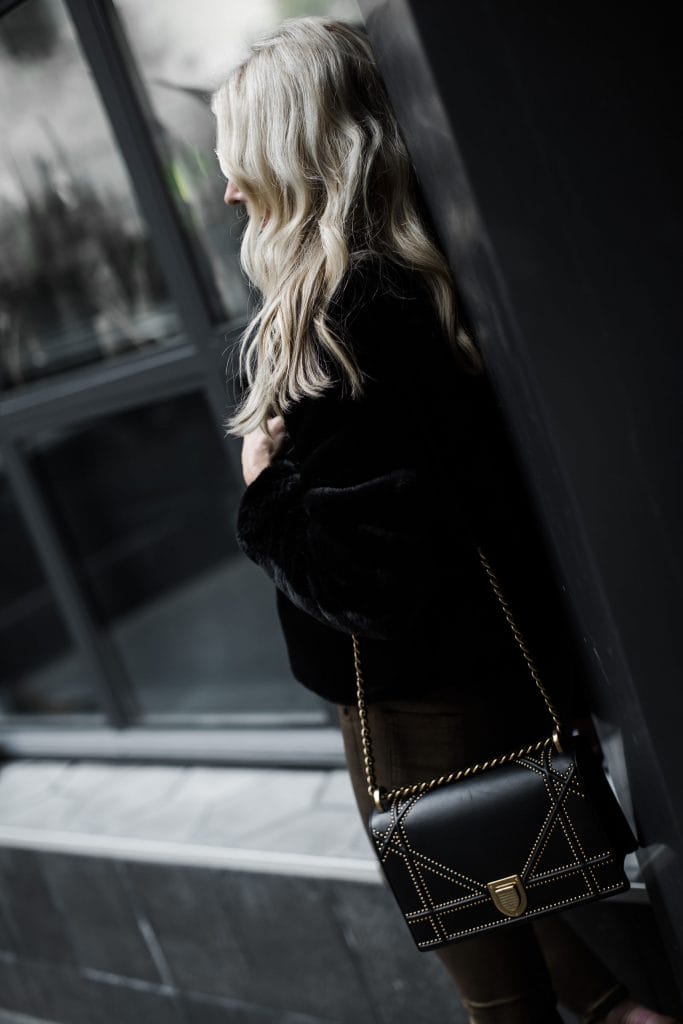 Dallas blogger wearing faux fur jacket and Dior Handbag 
