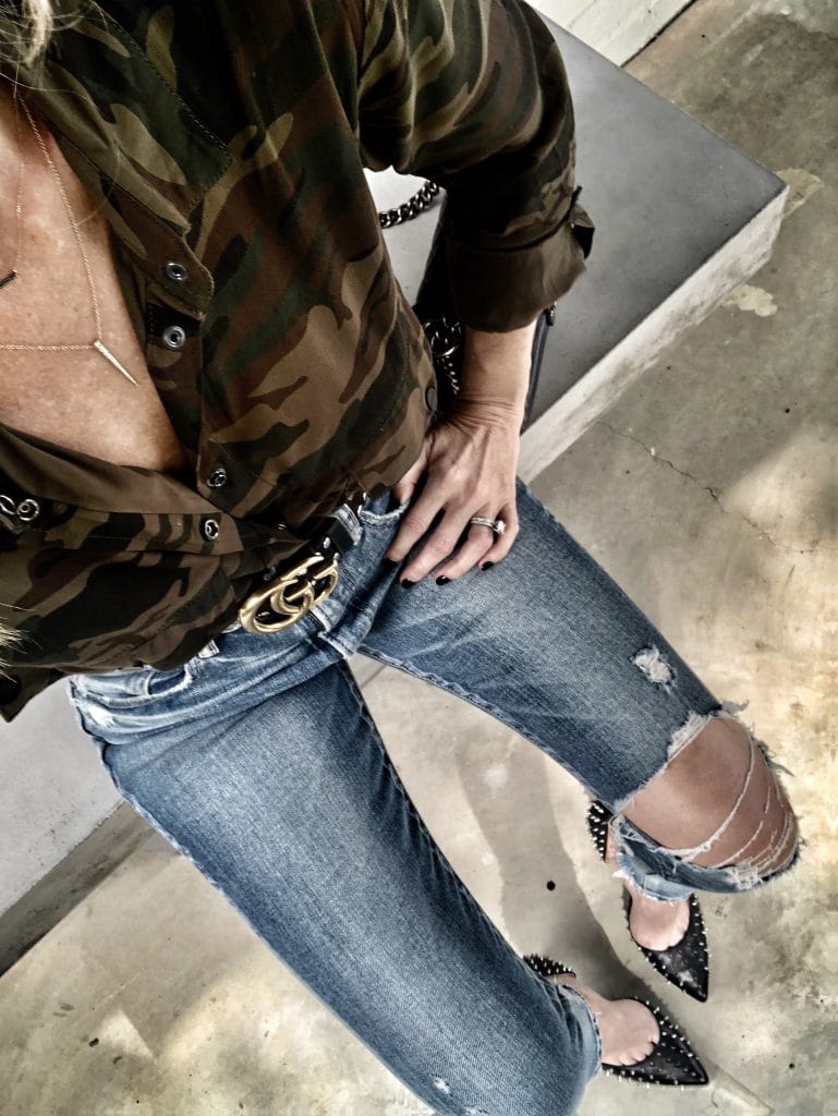 Dallas blogger wearing camo shirt and ripped jeans 