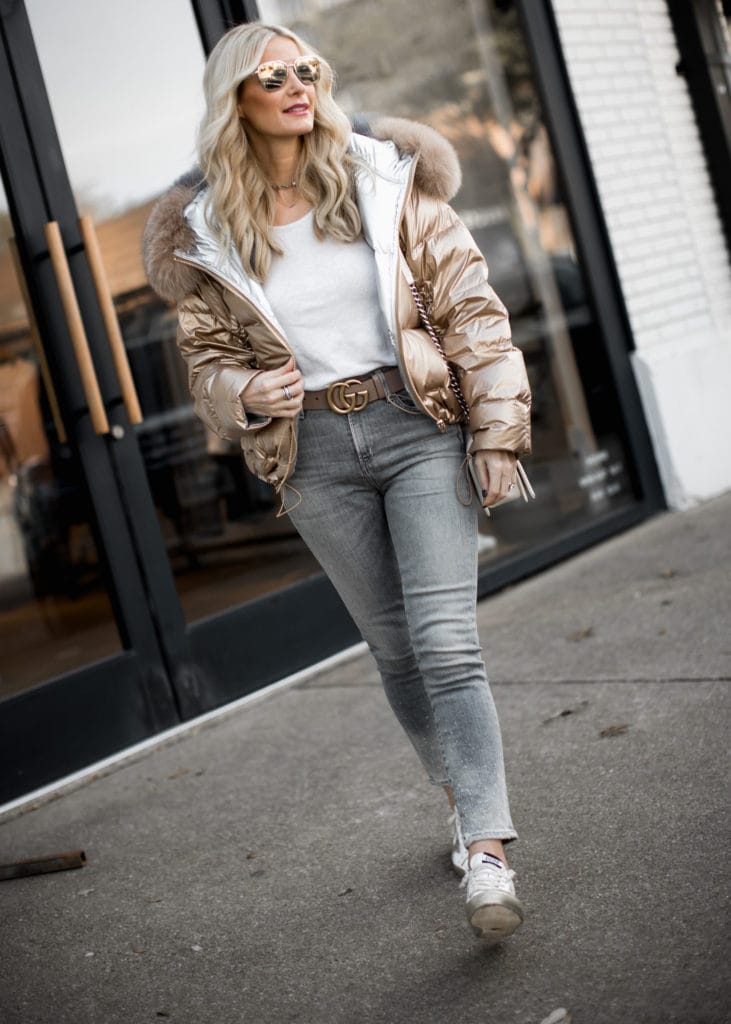 Dallas fashion blogger wearing puffer jacket, Golden Goose sneakers, and Gucci belt 