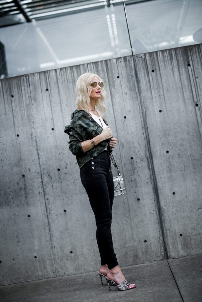 Dallas blogger wearing camo jacket, snake print heels, and J Brand Natasha jeans 