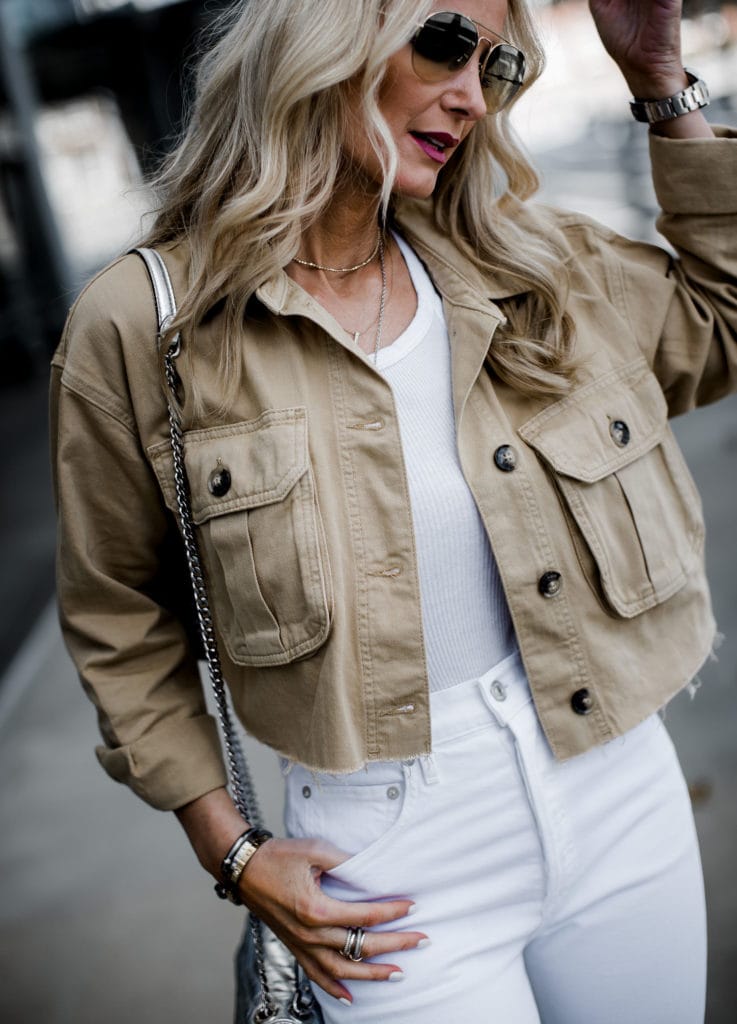 Dallas blogger wearing cropped utility jacket and white jeans 