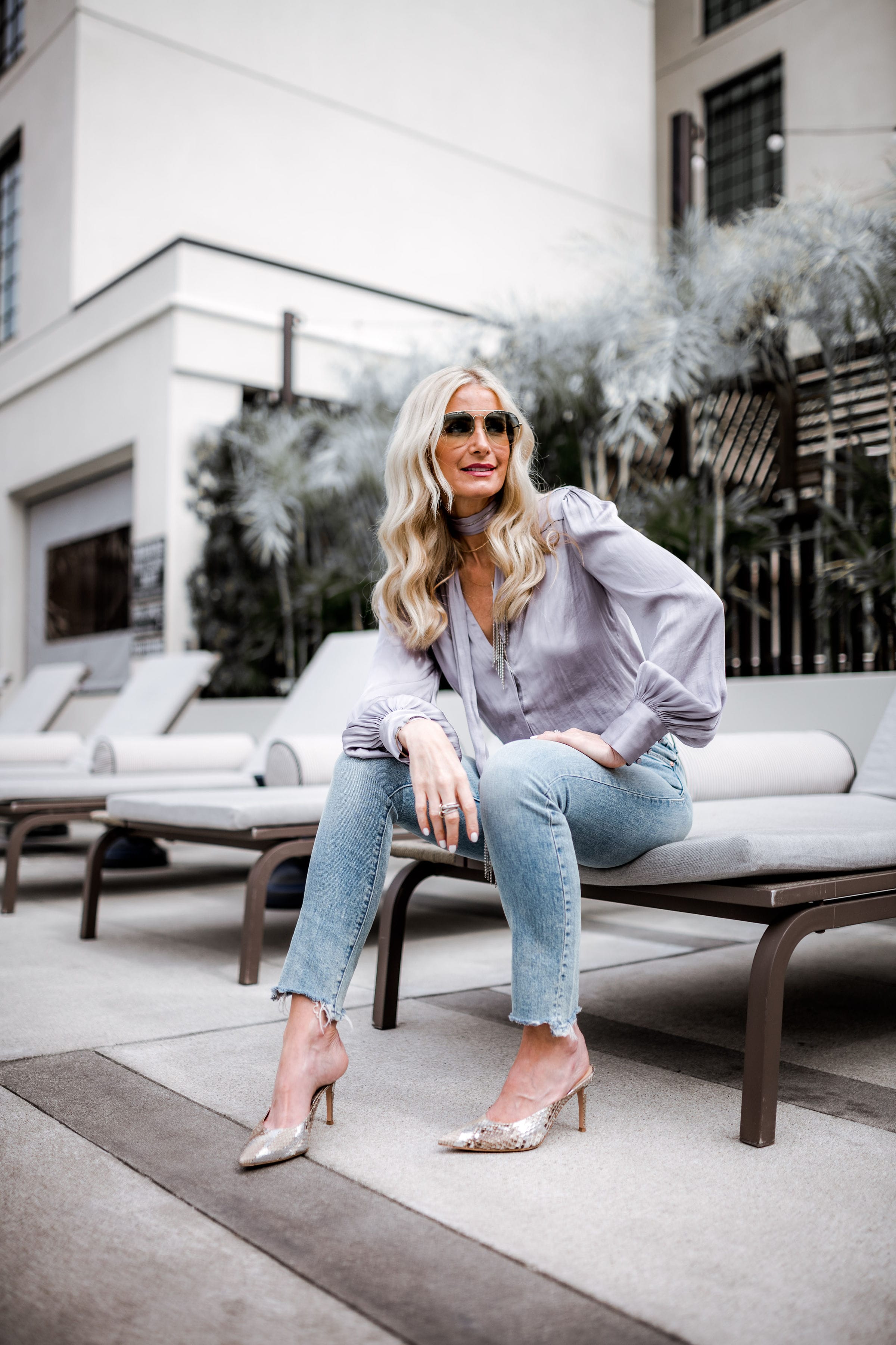 Dallas blogger wearing Paige satin top and Mother jeans 