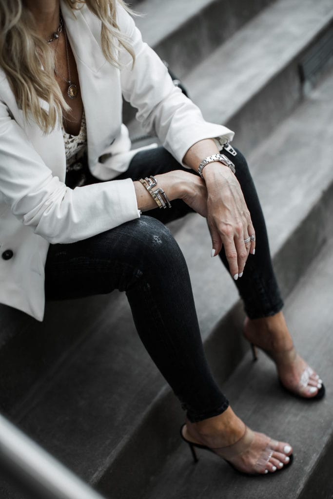 Dallas blogger wearing Moussy jeans and a white blazer 