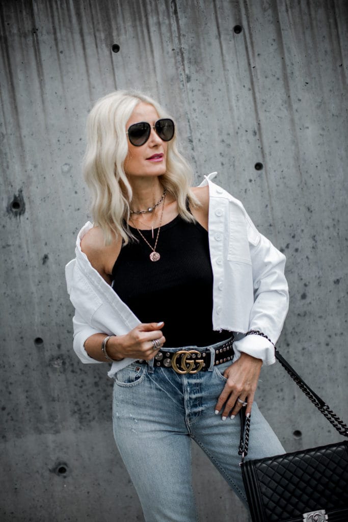 Dallas blogger wearing a white denim jacket and Gucci Belt 