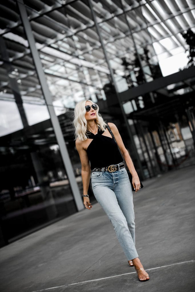 Dallas style blogger wearing a black top and Trave denim 