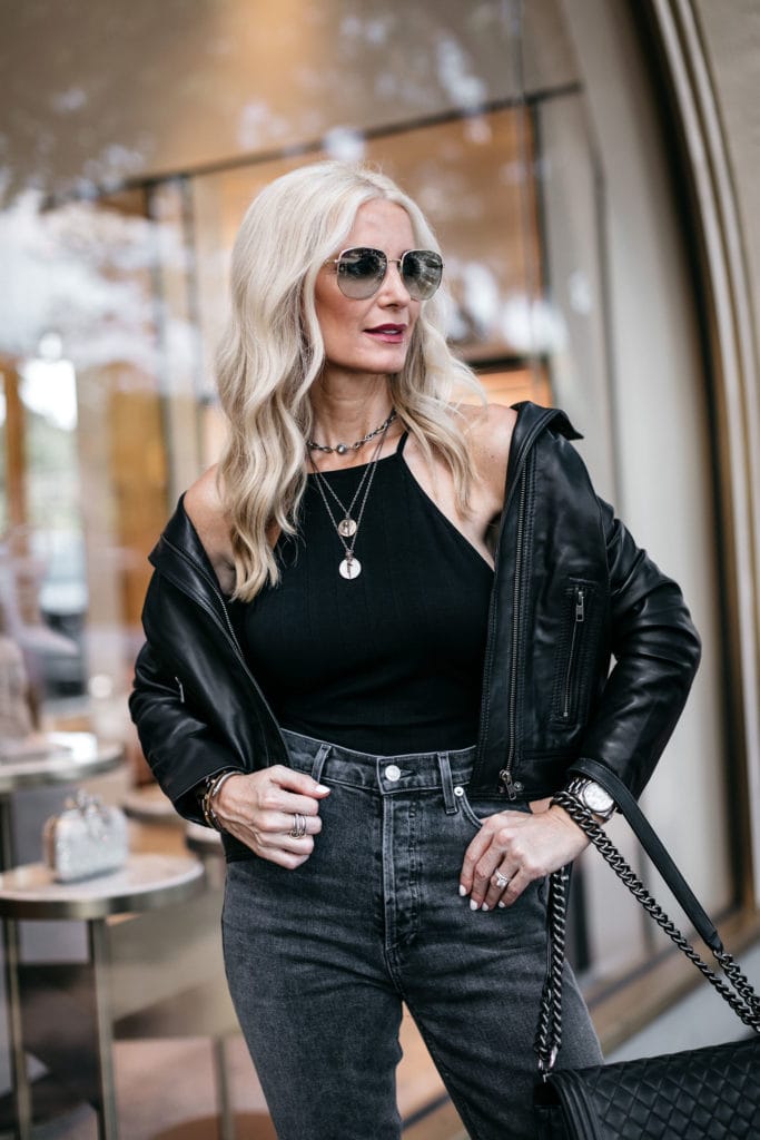 Dallas fashion blogger wearing a black leather jacket and Agolde jeans