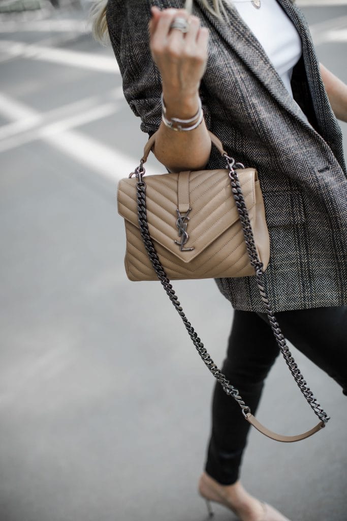 Dallas blogger carrying a Saint Laurent handbag 