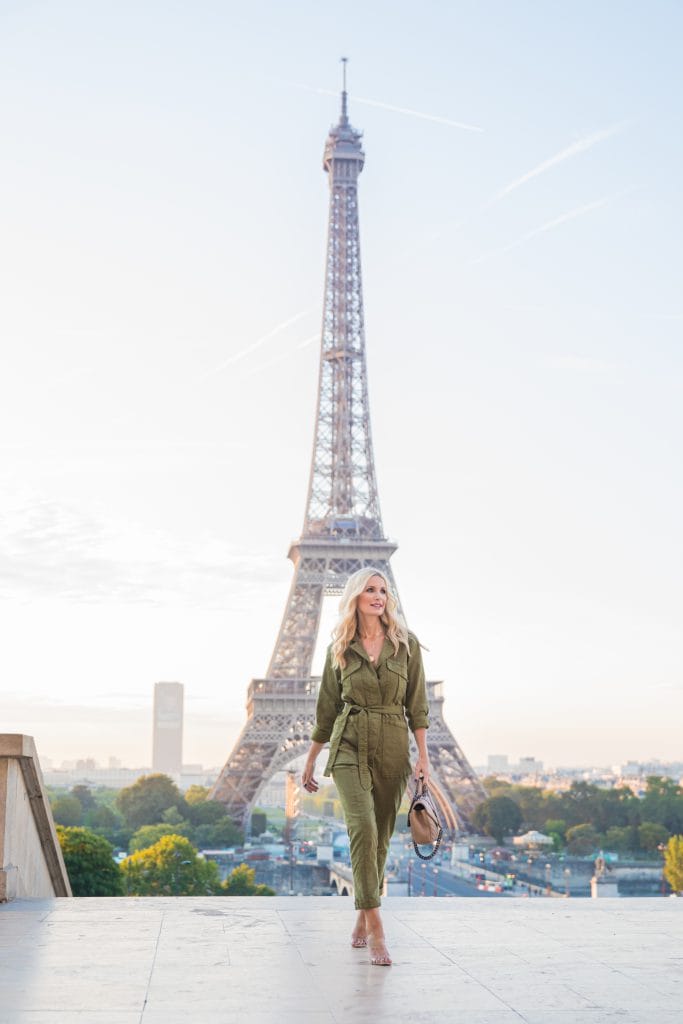 Dallas style blogger wearing a green jumpsuit in Paris 