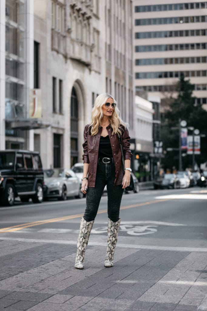Dallas fashion blogger wearing a faux leather shirt jacket and knee high boots