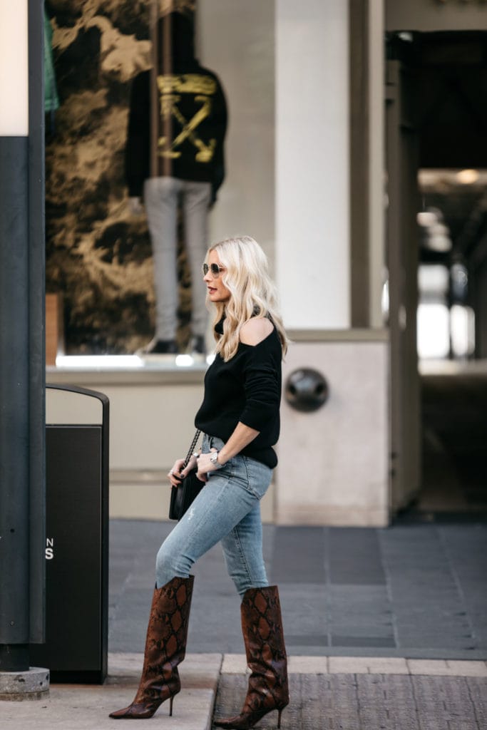 Dallas style blogger wearing denim and a black sweater