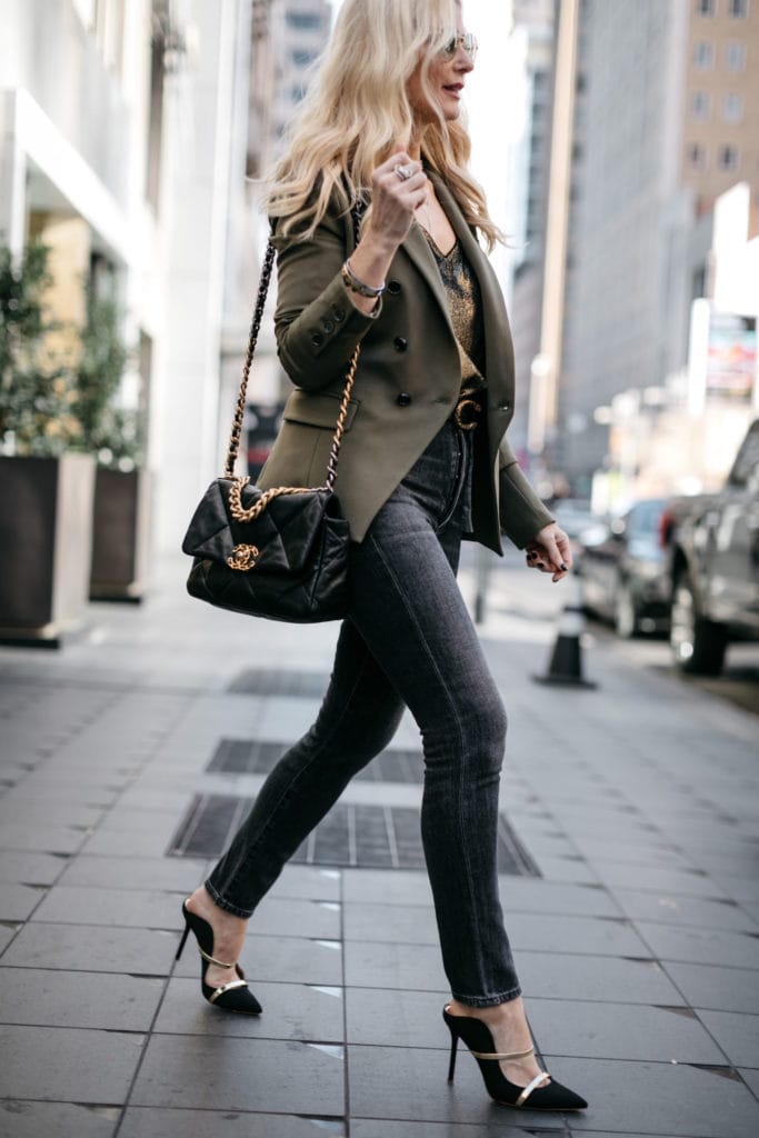 Fashion blogger wearing black heels and a black handbag