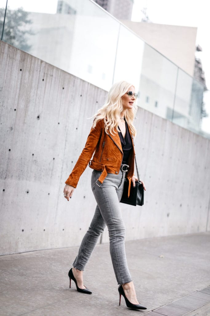 Blogger wearing a moto jacket and black heels
