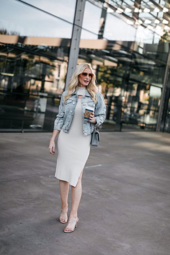 Dallas blogger wearing a denim jacket and a dress