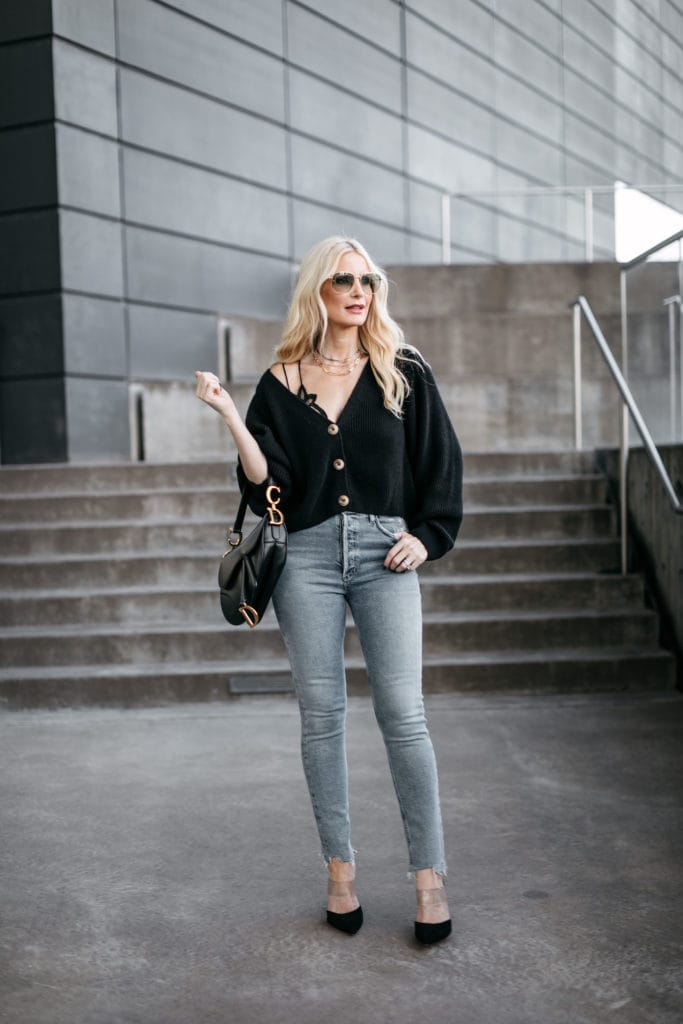 Dallas blogger wearing a black cardigan and a Dior handbag 