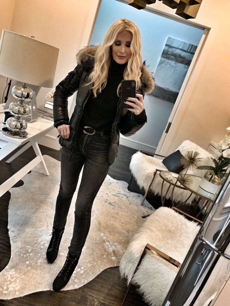 Dallas blogger wearing a fur hooded jacket with jeans