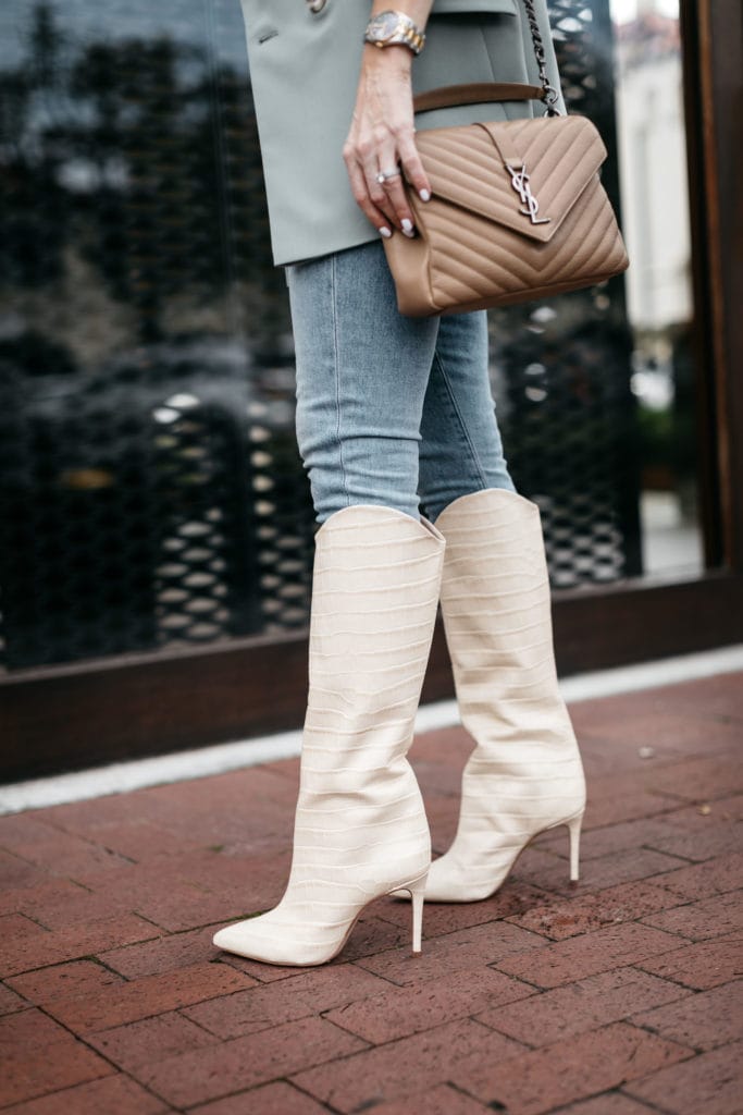 Dallas fashion blogger wearing knee high boots and jeans