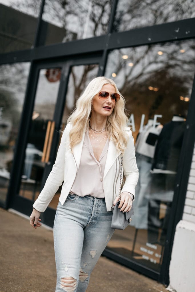Dallas blogger wearing a white leather jacket 