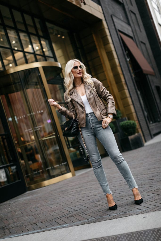 Fashion blogger wearing a moto jacket and jeans
