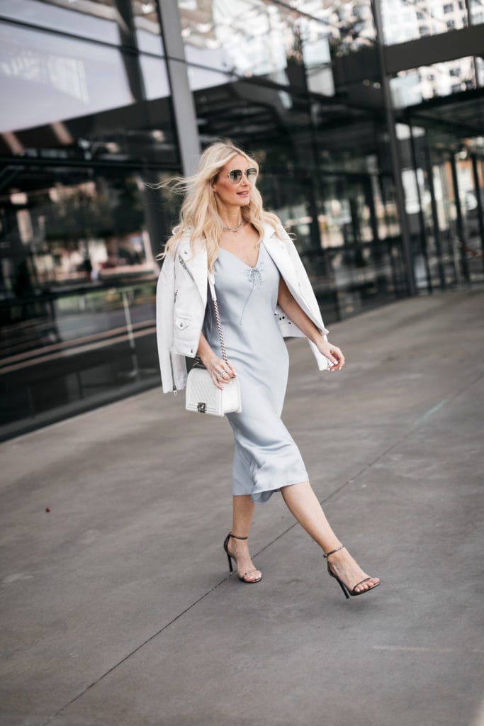Dallas influencer wearing a midi dress and heels