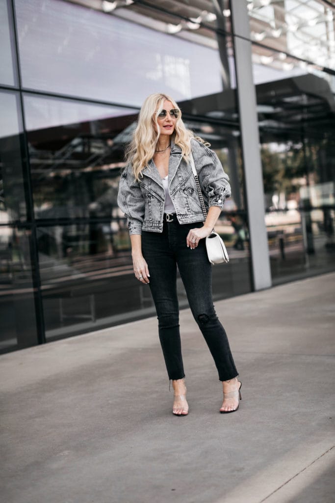 Dallas blogger wearing a grey denim jacket and black jeans