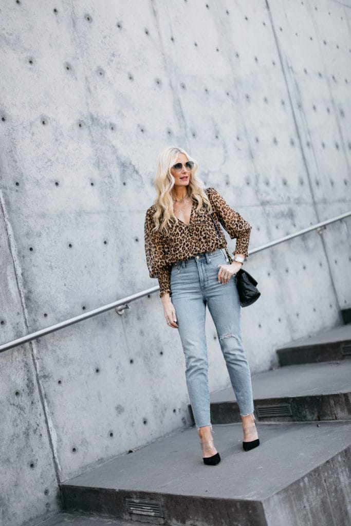 Dallas influencer wearing a leopard top and jeans