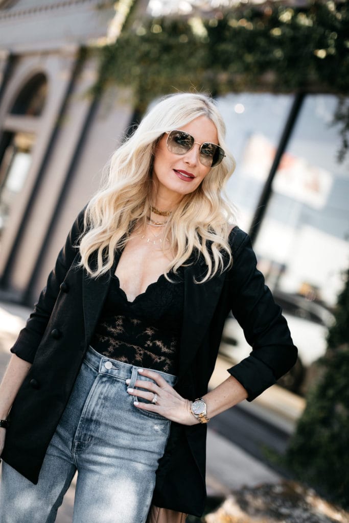 Style blogger wearing a black lace cami with a black oversized blazer