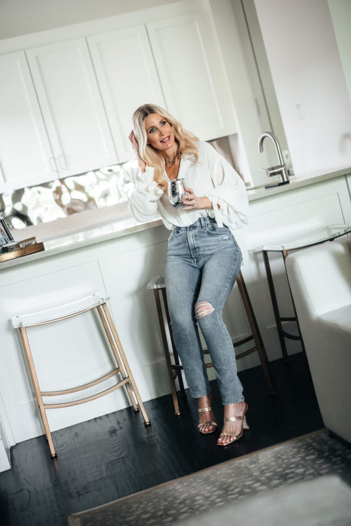 Fashion blogger wearing straight leg jeans and a white shirt