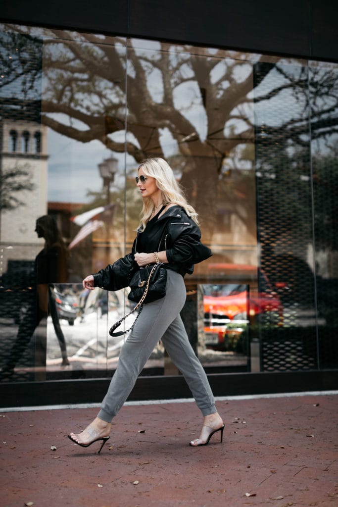 Dallas blogger wearing grey joggers and heels