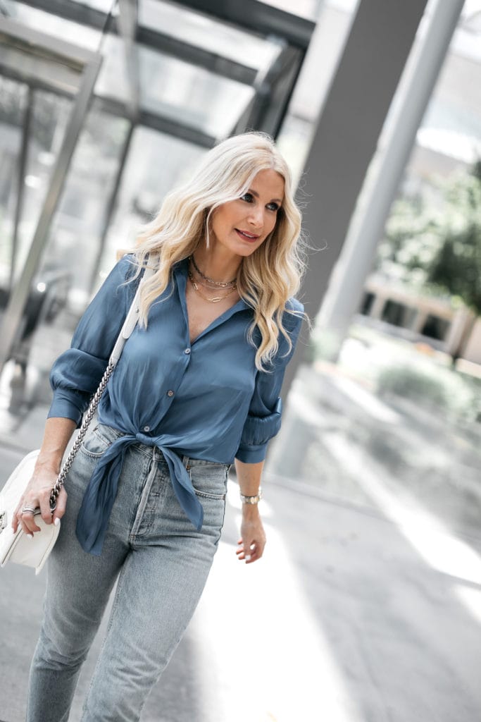Dallas blogger wearing a silk blue blouse and denim