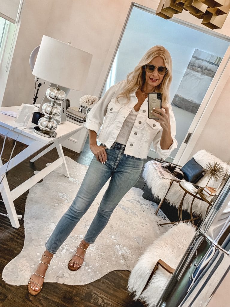 Dallas blogger wearing a white denim jacket and studded summer sandals