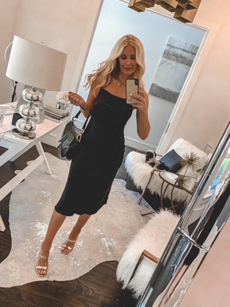 Dallas blogger wearing a black slip dress and gold sandal heels