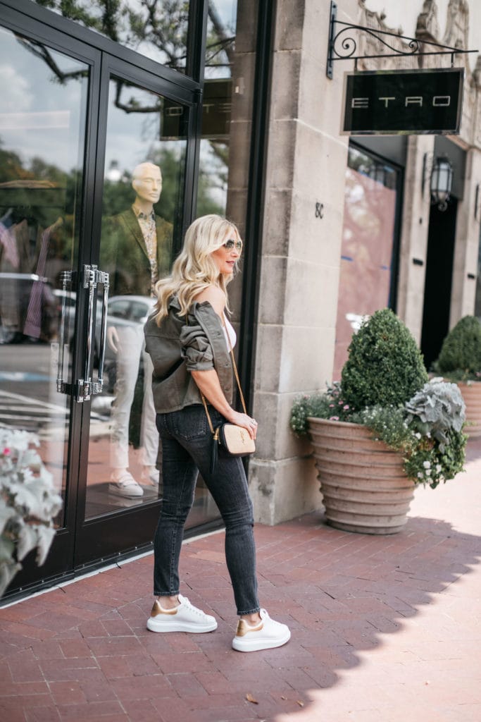 Dallas blogger wearing army green utility jacket and white sneakers
