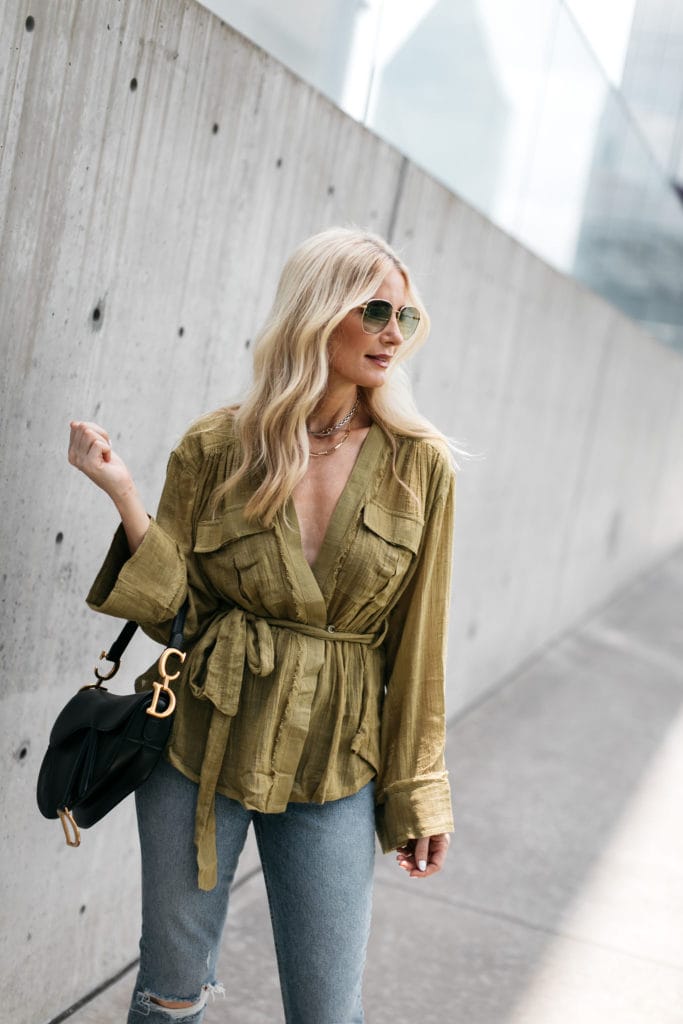 Style blogger wearing an olive green summer top