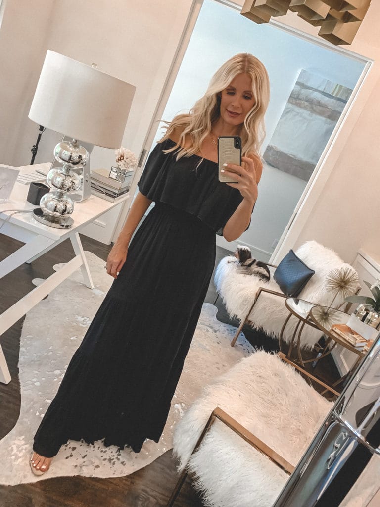 Fashion blogger wearing an off-the-shoulder black maxi dress