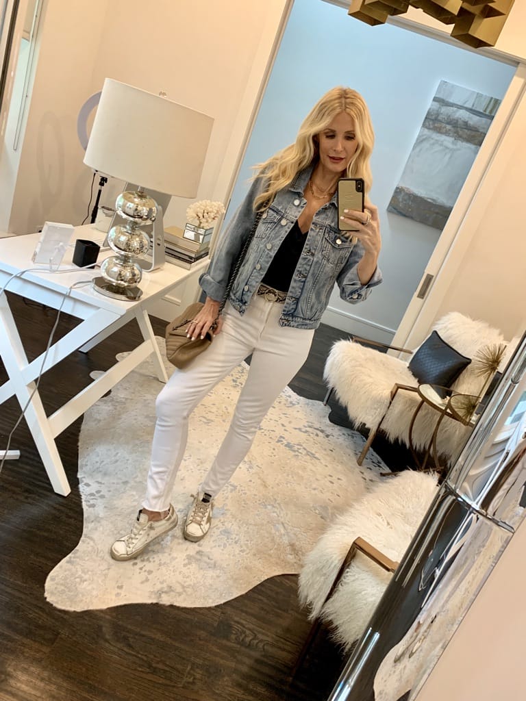 Dallas blogger wearing a denim jacket and white jeans