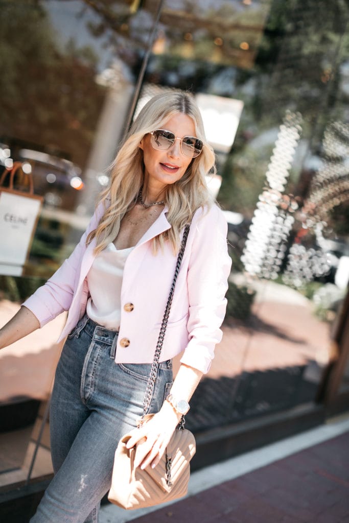 Dallas style blogger wearing a cropped pink blazer and white bodysuit