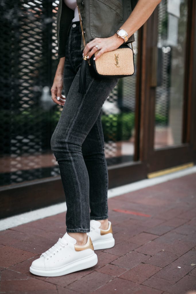 Style influencer wearing black denim and YSL handbag