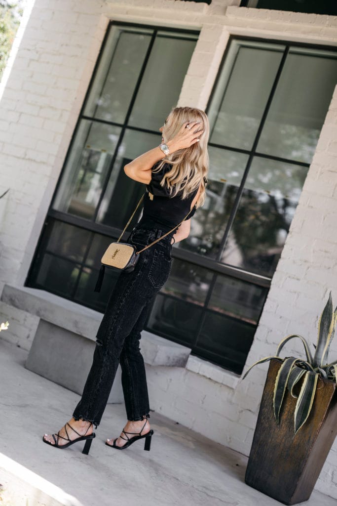 Fashion blogger wearing a black on black outfit in the summer
