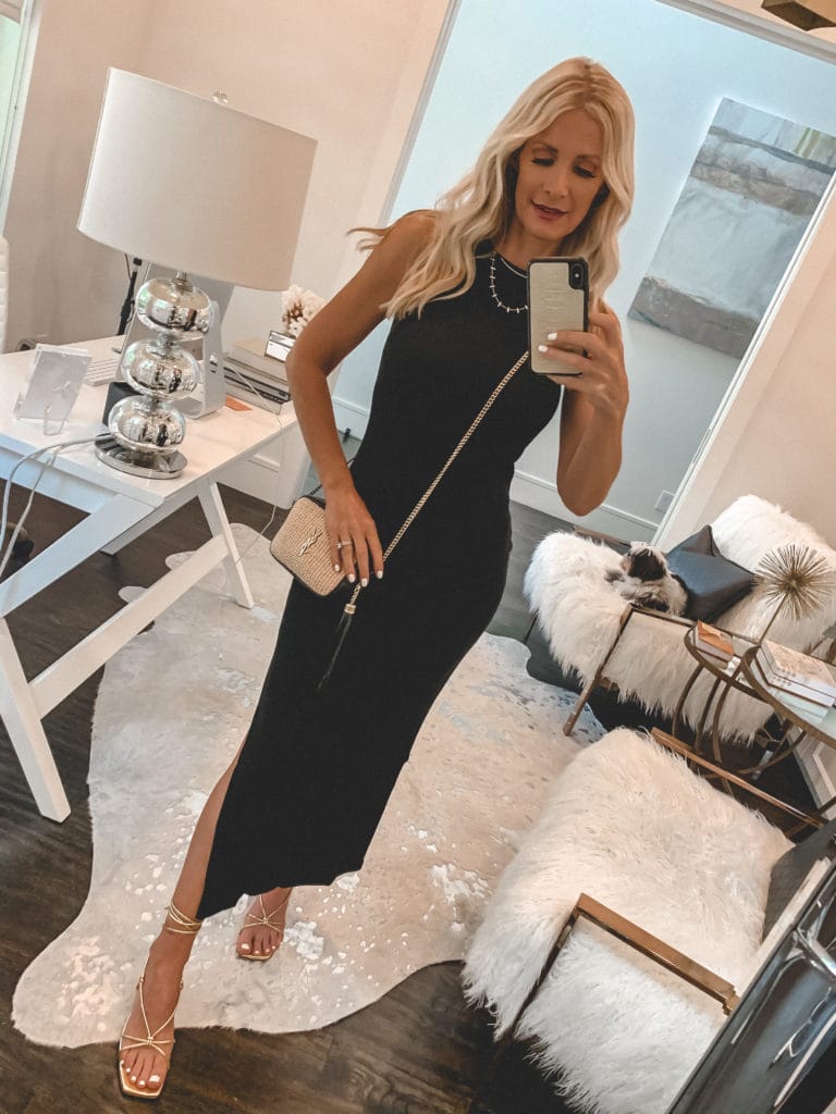 Style influencer wearing a black summer midi dress and gold strappy heels