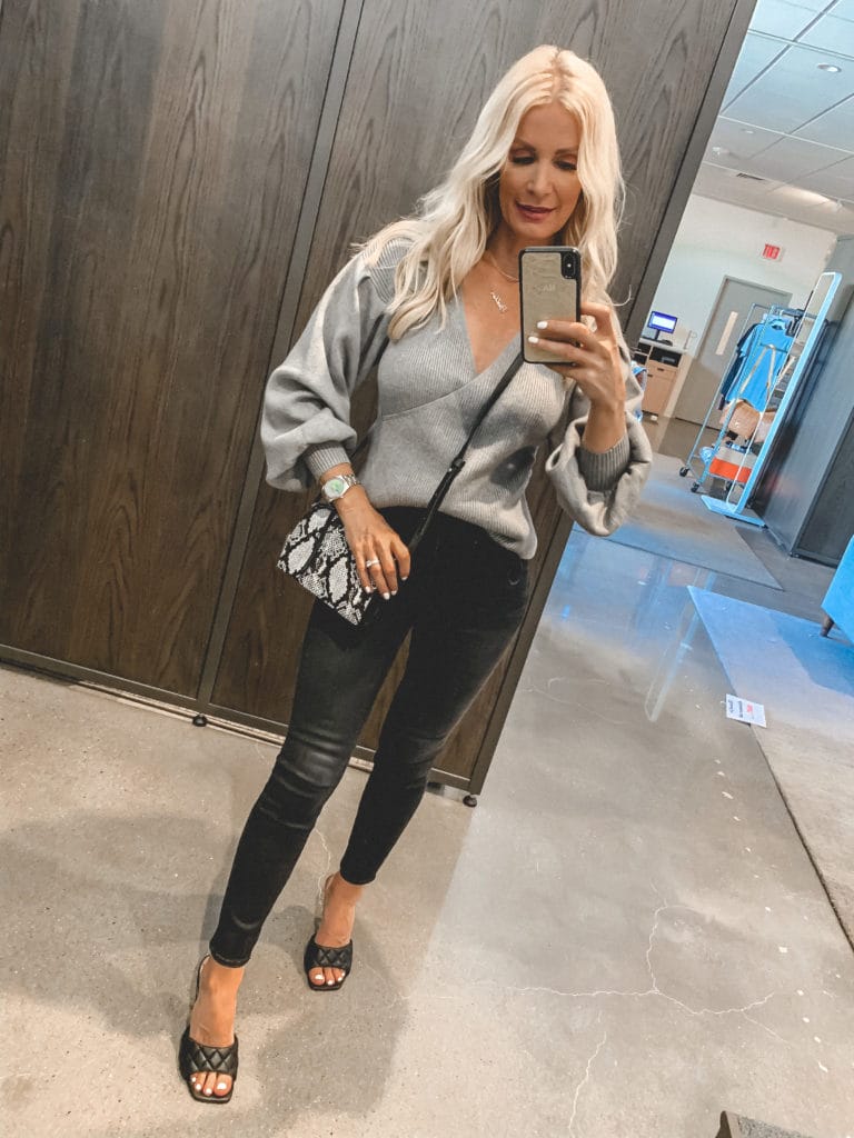 Dallas fashion blogger wearing a grey sweater and black denim