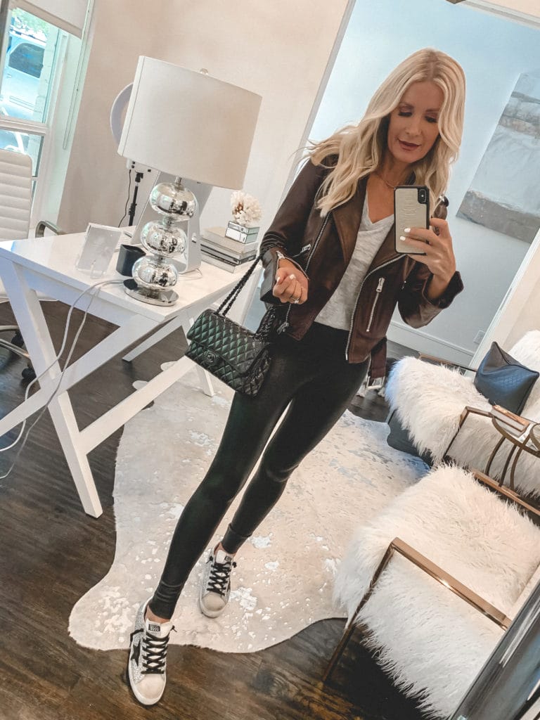 Dallas blogger wearing leather leggings and a burgundy leather Moto jacket 