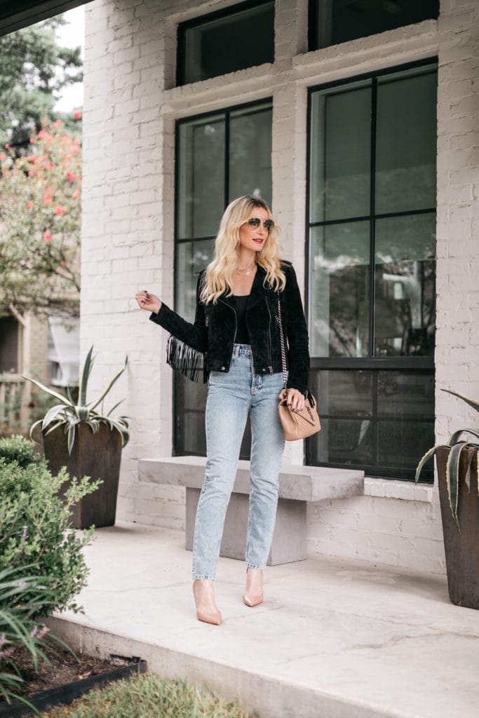 Dallas fashion blogger wearing a black fringe jacket and light wash denim for fall