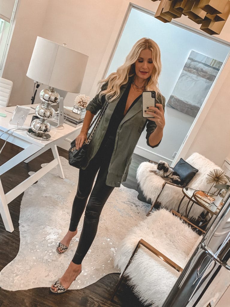 Dallas fashion blogger wearing a jacket and a black tank with leggings