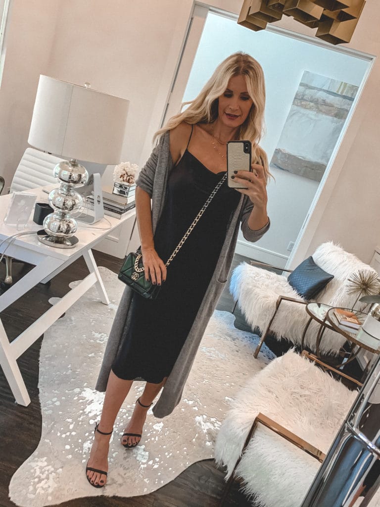 Dallas style blogger wearing a long grey cardigan and a black slip dress