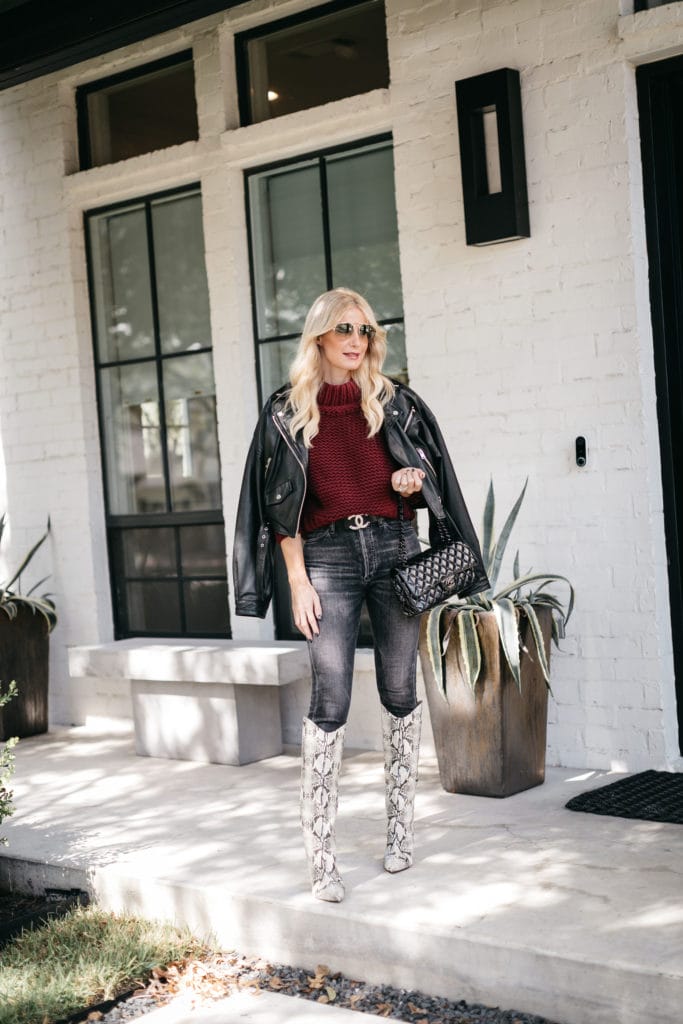 Dallas fashion blogger wearing black denim and knee high snakeskin boots